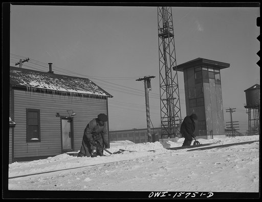 Chicago, Illinois. Cleaning out switches on a cold winter day at the clearing yard. Belt Railway Company of Chicago