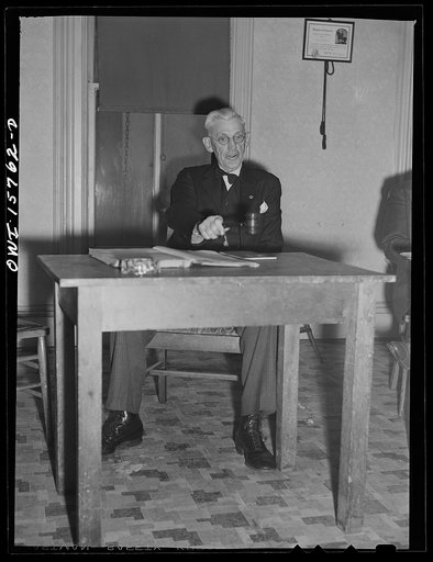 West Chicago, Illinois. Mr. W.M. Hoag, president, opens the meeting of the west Chicago Lodge of the International Brotherhood of Railway Trainmen (Northwestern Railroad local)