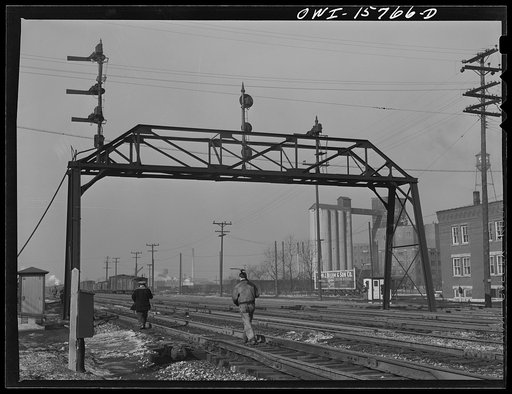 Untitled photo, possibly related to: Hammond, Indiana. Section crews returning from work along the Michigan Central Railroad tracks].