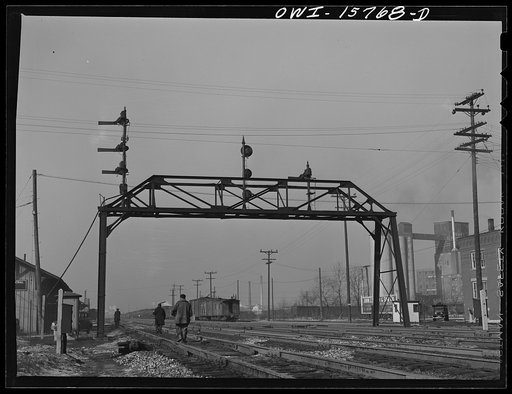Untitled photo, possibly related to: Hammond, Indiana. Section crews returning from work along the Michigan Central Railroad tracks].