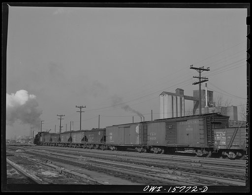 Untitled photo, possibly related to: Hammond, Indiana. Indiana Harbor Belt Railroad train on the Michigan Central Railroad tracks. Both the Indiana Harbor Belt Railroad and the Michigan Central Railroad are subsidiaries of the New York Central Railroad