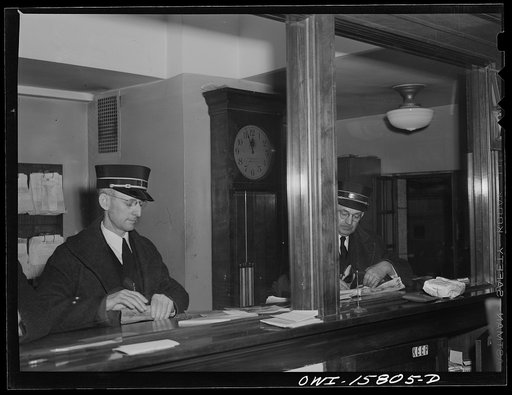 Chicago, Illinois. Conductors checking in at the dispatcher's office at the Union Station