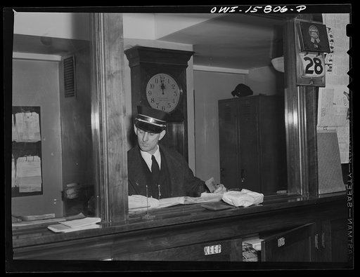 Chicago, Illinois. Conductor checking in at the dispatcher's office at the Union Station