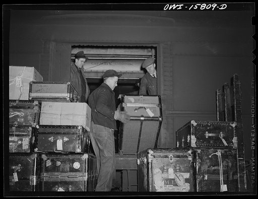 Chicago, Illinois. Unloading baggage from a train that has just come into the Union Station