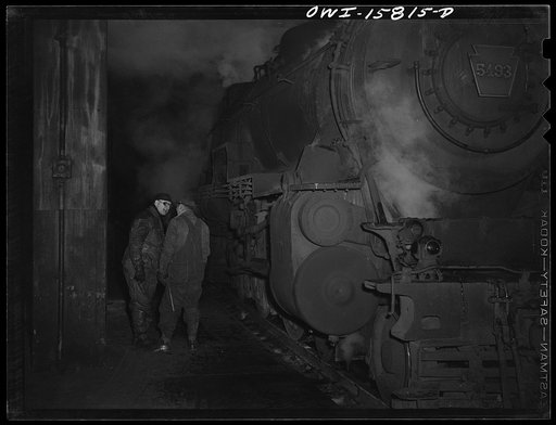Chicago, Illinois. Engineer and trainman chatting on a train platform at the Union Station