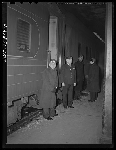 Chicago, Illinois. Porters, conductor, and brakeman at Union Station