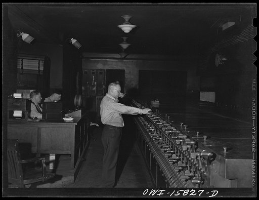Untitled photo, possibly related to: Chicago, Illinois. In the interlocking tower at Union Station. It is here that all inbound and outbound traffic is controlled. The men work entirely by the board, hardly ever looking out of a window to see an actual train