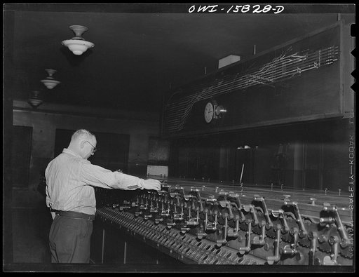 Untitled photo, possibly related to: Chicago, Illinois. In the interlocking tower at Union Station. It is here that all inbound and outbound traffic is controlled. The men work entirely by the board, hardly ever looking out of a window to see an actual train