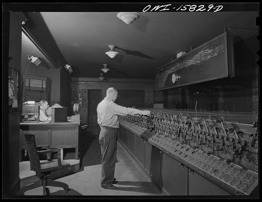 Untitled photo, possibly related to: Chicago, Illinois. In the interlocking tower at Union Station. It is here that all inbound and outbound traffic is controlled. The men work entirely by the board, hardly ever looking out of a window to see an actual train