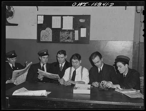 Chicago, Illinois. In the Redcaps' locker room at the Union Station. The three men on the right are counting their stubs