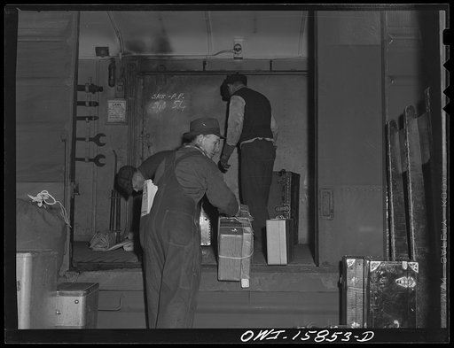 Chicago, Illinois. Unloading a baggage car at Union Station