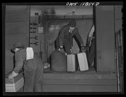 Untitled photo, possibly related to: Chicago, Illinois. Unloading a baggage car at Union Station