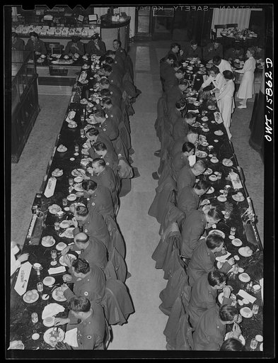 Chicago, Illinois. Soldiers being served dinner in the Fred Harvey restaurant at the Union Station