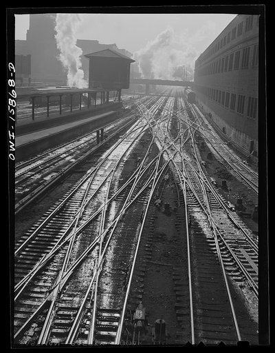Chicago, Illinois. Tracks leading into a station. On the left is an interlocking tower