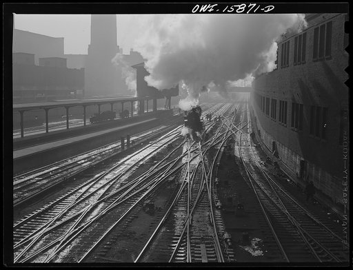 Chicago, Illinois. Tracks leading into a station. On the left is an interlocking tower