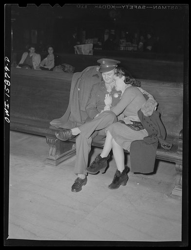 Chicago, Illinois. Soldier and girl waiting for a train in the waiting room of the Union Station