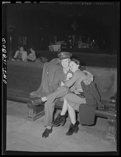 Untitled photo, possibly related to: Chicago, Illinois. Soldier and girl waiting for a train in the waiting room of the Union Station