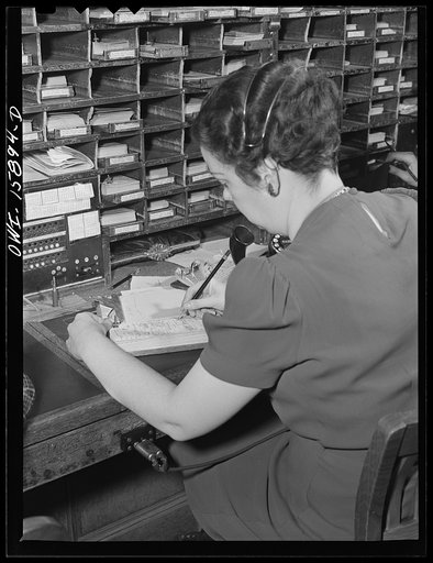 Chicago, Illnois. Reservation girl at the Union Station making reservation on a diagram