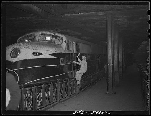 Chicago, Illinois. Engineer coming out of the cab of the Alton train "Abraham Lincoln" at Union Station