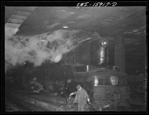 Chicago, Illinois. One of the Pennsylvania railroad's giant 6100 class engines about to pull out on the "Manhattan Limited" run at the Union Station