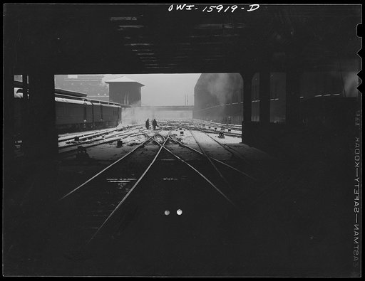 Chicago, Illinois. Section crew cleaning out ice from switches of tracks