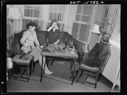 Untitled photo, possibly related to: Detroit, Michigan. Girls playing cards and drinking coca cola