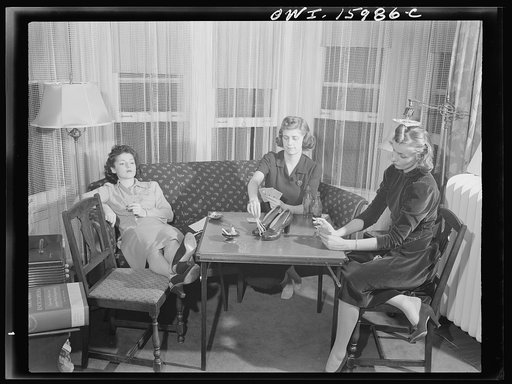 Untitled photo, possibly related to: Detroit, Michigan. Girls playing cards and drinking coca cola