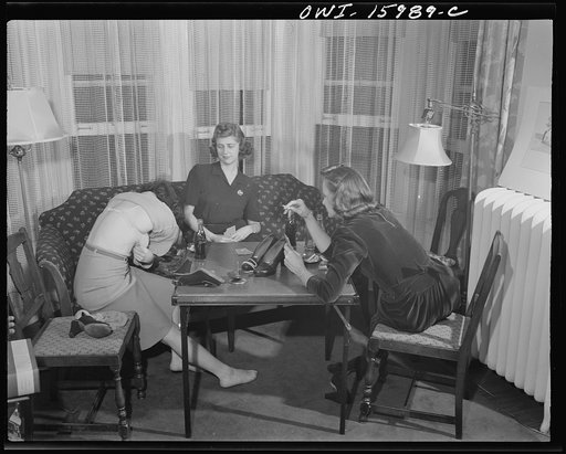 Untitled photo, possibly related to: Detroit, Michigan. Girls playing cards and drinking coca cola