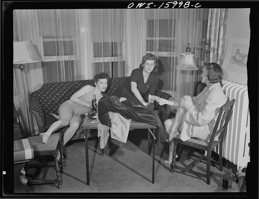 Untitled photo, possibly related to: Detroit, Michigan. Girls playing cards and drinking coca cola