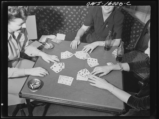 Untitled photo, possibly related to: Detroit, Michigan. Girls playing cards and drinking coca cola