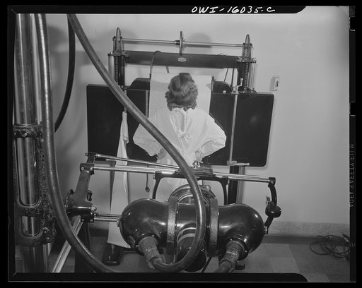 Detroit, Michigan. New method of making x-ray photographs size 4x5 inches instead of larger. Used at the Herman Kiefer Hospital for Communicable Diseases to show various stages of tuberculosis. The x-ray plate is contained in the apparatus in front of the girl. The apparatus in the foreground contai