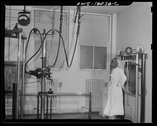 Detroit, Michigan. New method of making x-ray photographs size 4x5 inches instead of larger. Used at the Herman Kiefer Hospital for Communicable Diseases to show various stages of tuberculosis. The x-ray plate is contained in the apparatus in front of the girl. The apparatus in the foreground contai