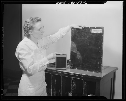 Detroit, Michigan. New method of making x-ray photographs size 4x5 inches instead of larger. Used at the Herman Kiefer Hospital for Communicable Diseases to show various stages of tuberculosis. Comparison of the standard x-ray film holder and the 4x5 film holder used in the x-ray camera