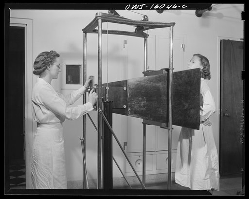 Detroit, Michigan. New method of making x-ray photographs size 4x5 inches instead of larger. Used at the Herman Kiefer Hospital for Communicable Diseases to show various stages of tuberculosis. Making an x-ray exposure by photographing the fluorescent screen