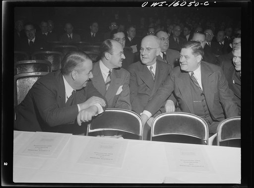 Detroit, Michigan. Left to right: Unknown; Ernest Kanzler and Alvin MacCauley of the Packard Motor Car Company; Keller of the Chrysler Corporation at an early meeting of the Automobile Council for War Production