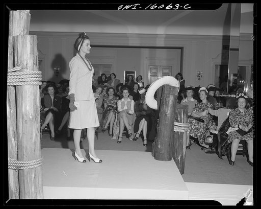 Detroit, Michigan. Style show of clothes worn by better-dressed office workers, presented by the Chrysler Girls' Club of the Chrysler Corporation at Saks Fifth Avenue store. Chrysler girl modeling a suit