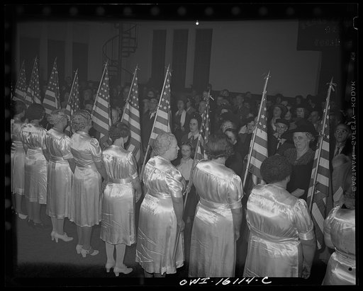 Toledo, Ohio. Evangelical church ceremony at which the preacher delivered a hysterical speech, and then burned a copy of Hitler's Mein Kampf. Sisters in satin dresses carrying American flags