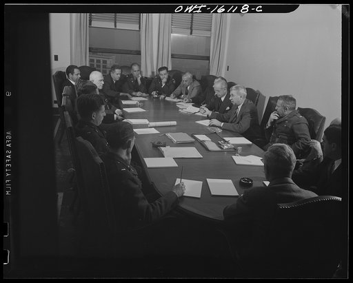 Untitled photo, possibly related to: Detroit, Michigan. Conference between U.S. Army ordnance and washing machine industry officials to determine the ability of manufacturers to produce parts needed by the Army. After inspecting samples, blueprints and prices were discussed