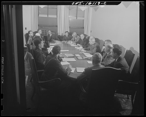 Detroit, Michigan. Conference between U.S. Army ordnance and washing machine industry officials to determine the ability of manufacturers to produce parts needed by the Army. After inspecting samples, blueprints and prices were discussed