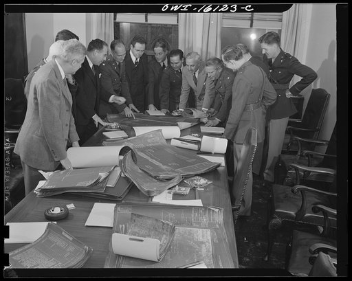 Untitled photo, possibly related to: Detroit, Michigan. Conference between U.S. Army ordnance and washing machine industry officials to determine the ability of manufacturers to produce parts needed by the Army. After inspecting samples, blueprints and prices were discussed