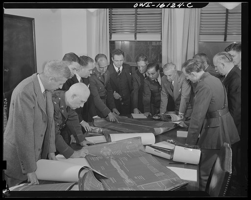 Detroit, Michigan. Conference between U.S. Army ordnance and washing machine industry officials to determine the ability of manufacturers to produce parts needed by the Army. After inspecting samples, blueprints and prices were discussed