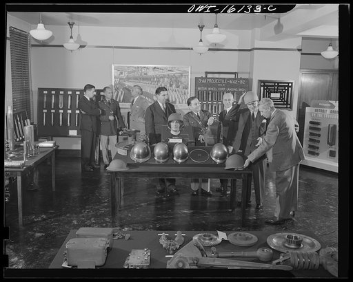 Detroit, Michigan. Conference between U.S. Army ordnance and washing machine industry officials to determine the ability of manufacturers to produce parts needed by the Army. After inspecting samples, blueprints and prices were discussed