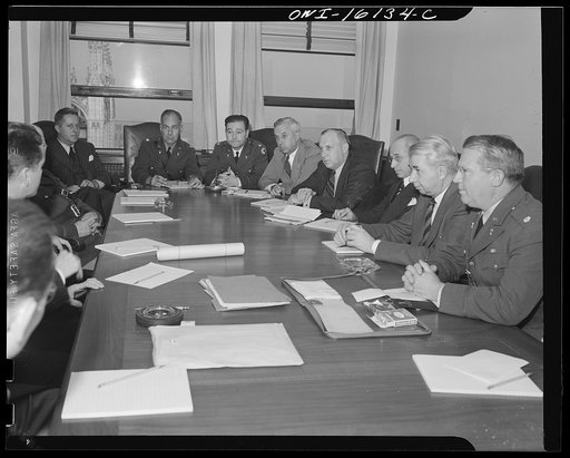 Detroit, Michigan. Conference between U.S. Army ordnance and washing machine industry officials to determine the ability of manufacturers to produce parts needed by the Army. After inspecting samples, blueprints and prices were discussed