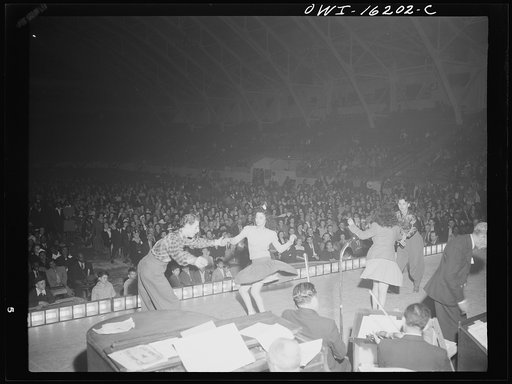 Detroit, Michigan. Jitterbug dancing as part of the entertainment at a scrap salvage rally sponsored by the Work Projects Administration (WPA) at the state fairgrounds