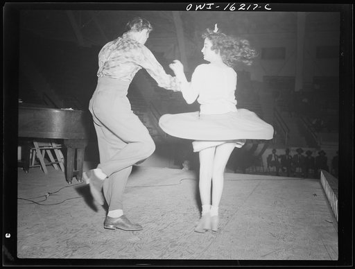 Detroit, Michigan. Jitterbug dancing as part of the entertainment at a scrap salvage rally sponsored by the Work Projects Adminstration (WPA) at the state fairgrounds