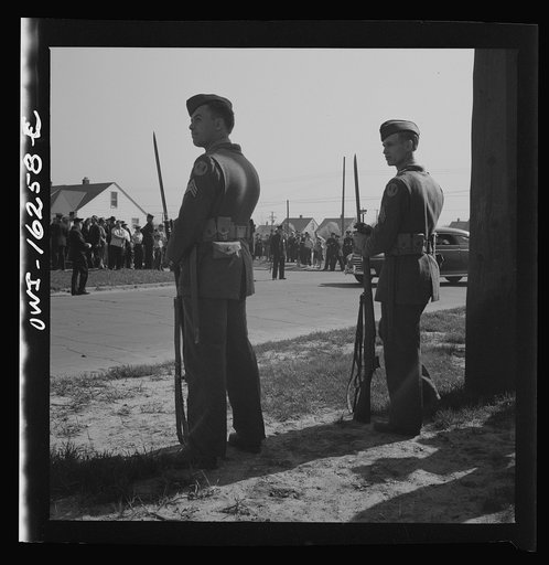 Untitled photo, possibly related to: Detroit, Michigan. Riot at the Sojourner Truth homes, a new U.S. federal housing project, caused by white neighbors' attempt to prevent Negro tenants from moving in. Home guard soldiers on duty