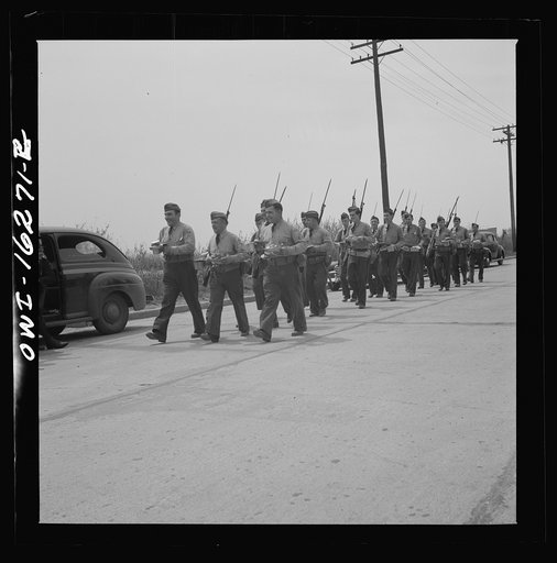 Detroit, Michigan. Riot at the Sojourner Truth homes, a new U.S. federal housing project, caused by white neighbors' attempt to prevent Negro tenants from moving in. Home guard troops carrying mess kits