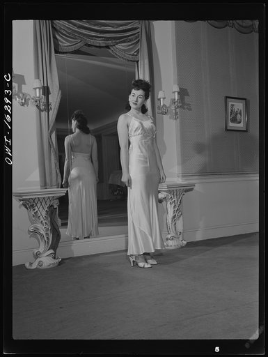 Untitled photo, possibly related to: Detroit, Michigan. Fashion show presented by the Chrysler Girls' Club of the Chrysler Corporation at Saks Fifth Avenue store. Girl in a slip