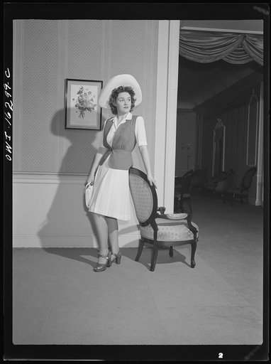 Detroit, Michigan. Fashion show presented by the Chrysler Girls' Club of the Chrysler Corporation at Saks Fifth Avenue store. Girl modeling a typical afternoon dress