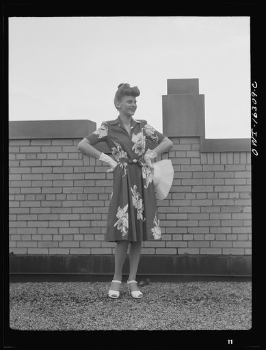 Untitled photo, possibly related to: Detroit, Michigan. Fashion show presented by the Chrysler Girls' Club of the Chrysler Corporation at Saks Fifth Avenue store. Girl laughing